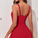 Blooming Stylish red sleeveless dress featuring a chic side knot. Perfect for any occasion. Photo 1