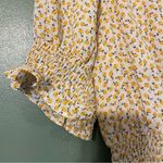 Sienna Sky Cream Smocked Peplum Blouse with yellow little flowers. Size M Photo 3