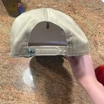 Tan and Green Hat Photo 1