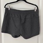 Adidas Women's Athletic Shorts in Dark Gray with Pink Accents Photo 1