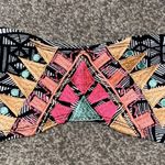 Size xs swim top perfect to pair with plain black bottoms! Good condition Photo 1