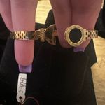 Stainless steel Gold Plated Roman Numeral Love Bangle. Photo 3