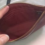 Coach  Corner Zip Wristlet in the color 1941 Red with Horse and Carriage print. Photo 5