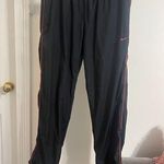 Nike Black Track Pants with Red Accents Photo 0