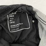 Universal Standard Mid Rise Skinny Seine Jeans in Distressed Black Photo 1