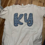 Boutique  T-Shirt Photo 0