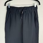 Lululemon  On the Fly Crop Pants Sz 4 Womens Black Travel Woven Mid Rise Photo 8