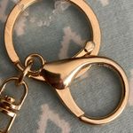 Rhinestone Cowgirl Black Fleur De Lis Keychain NWOT. Has Tassel and gold ball. Photo 3