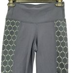 Athleta size XS dark blue 3/4 length leggings with geometric pattern down legs Photo 2