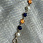 Multicolor bracelet orange, blue and white with gold Photo 1