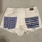 American Eagle  cream denim shorts. Stars and Stripes details on back pockets Photo 1