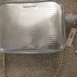 Victoria's Secret Victoria Secret purse/elegant bag. New with tags. Purse is silver. Strap is gold Photo 4