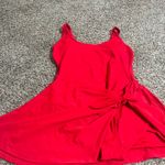 Blooming Stylish red sleeveless dress featuring a chic side knot. Perfect for any occasion. Photo 5