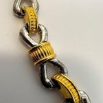 silver and gold tone bow necklace Photo 3