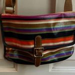 Fossil multicolor purse with adjustable strap in GUC. One small tear on bottom. Photo 0