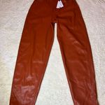 We Wore What NWT  Dani Vegan Leather Boyfriend Burnt Orange Dress Pants ( 26 )  Photo 0