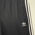 Adidas  unisex Black Joggers with White Stripes Photo 3