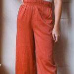 Altar'd State ORANGE HIGH WAISTED FLARE PANTS Photo 0