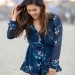 Japna NWOT Revolve  Blue Floral splice ruffle hem Romper. Size Small Photo 2