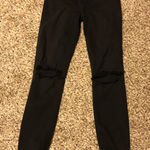 Reformation ❤️  black skinny jeans with knee rips Photo 0