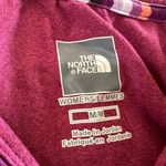 The North Face  women’s long sleeve size medium Photo 1