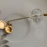 Vintage goldtone & clear lucite faceted ball hat pin with a rose locket Photo 2