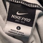 Nike Women's Black and Gray Patterned Hoodie Photo 9