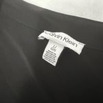 Calvin Klein  Black Top with Sheer Sleeves Photo 1