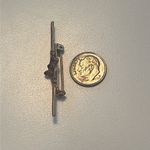 Vintage 1970s gold tone feminine bar brooch with red stones Photo 5