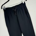 Lululemon  On the Fly Crop Pants Sz 4 Womens Black Travel Woven Mid Rise Photo 5