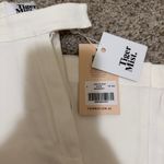 Tiger Mist  - White Pants Photo 3