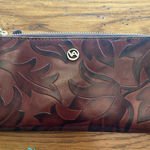 Valentina Embossed Leather Zip Around Wallet with a Leaf Motif Pattern in Brown Photo 0