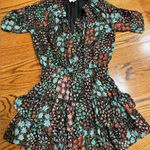 Skylar + Madison  Black Dress with Floral Accents Photo 0