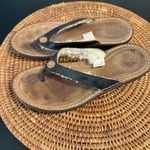 UGG  Brown and Black leather Flip Flops with Button Detail Photo 1