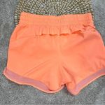 Athleta Mesh Racer Run Mid Rise 4” Shorts Pull On Running in Orange Size XXS Photo 5