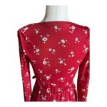 Hollister -RED FLORAL DRESS-SIZE XS Gorgeous red floral faux wrap dress, long sleeves,v neck had hook closure, dress is fully lined, semi sheer sleeves, elastic waist, excellent condition Measurements: Bust: armpit to armpit 16 inches Waist: side to side 12-15 inches Length: shoulder seam to bottom 36 1/2 inches Photo 5