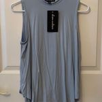 Alison Andrews  sky blue swing high neck tank Photo 0