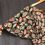 Intrigue , medium dress with flutter sleeves, a V-neck Photo 4