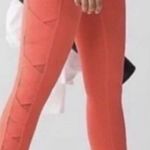 Lululemon  Rise and Flow Pant Mesh Criss Cross Size 4 Orange Coral EUC Photo 0