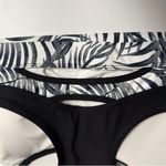 Xersion NWT  Medium-Impact Sports Bra, Black/White Palm Print Photo 3