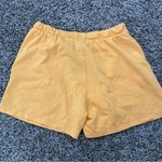 H&M  orange sweatshorts Photo 4