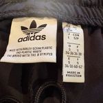 Adidas  track pants white stripes and a slim tapered leg women’s S long Photo 7