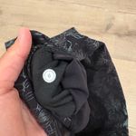 Lululemon Wunder Train High Rise Tight 25” in Logo Flourish Black Foil Photo 3