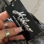 Milano silver satin A line skirt with pleated hem Black Size 8 Photo 2