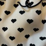Cross body white with black hearts purse Photo 4