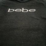 Bebe crop top
Black long sleeve shirt with with logo on front
Size medium Photo 3