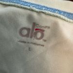 Alo Yoga white and Light Blue Top cool fit size large Photo 1