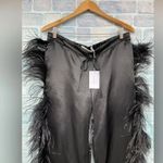 MARQUES' ALMEIDA
Feather Photo 1