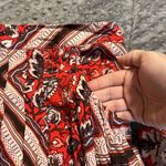 Free People  size 4 shark bite hem skirt red geometric zip back pockets on side Photo 3