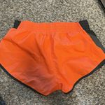 Nike  Orange and Black Athletic Shorts Photo 1